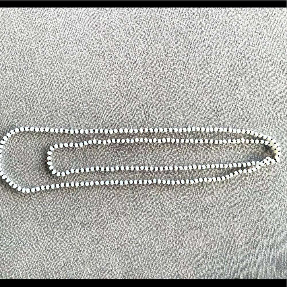 Hand made beaded Necklace. White beads, slightly iridescent. Versatile